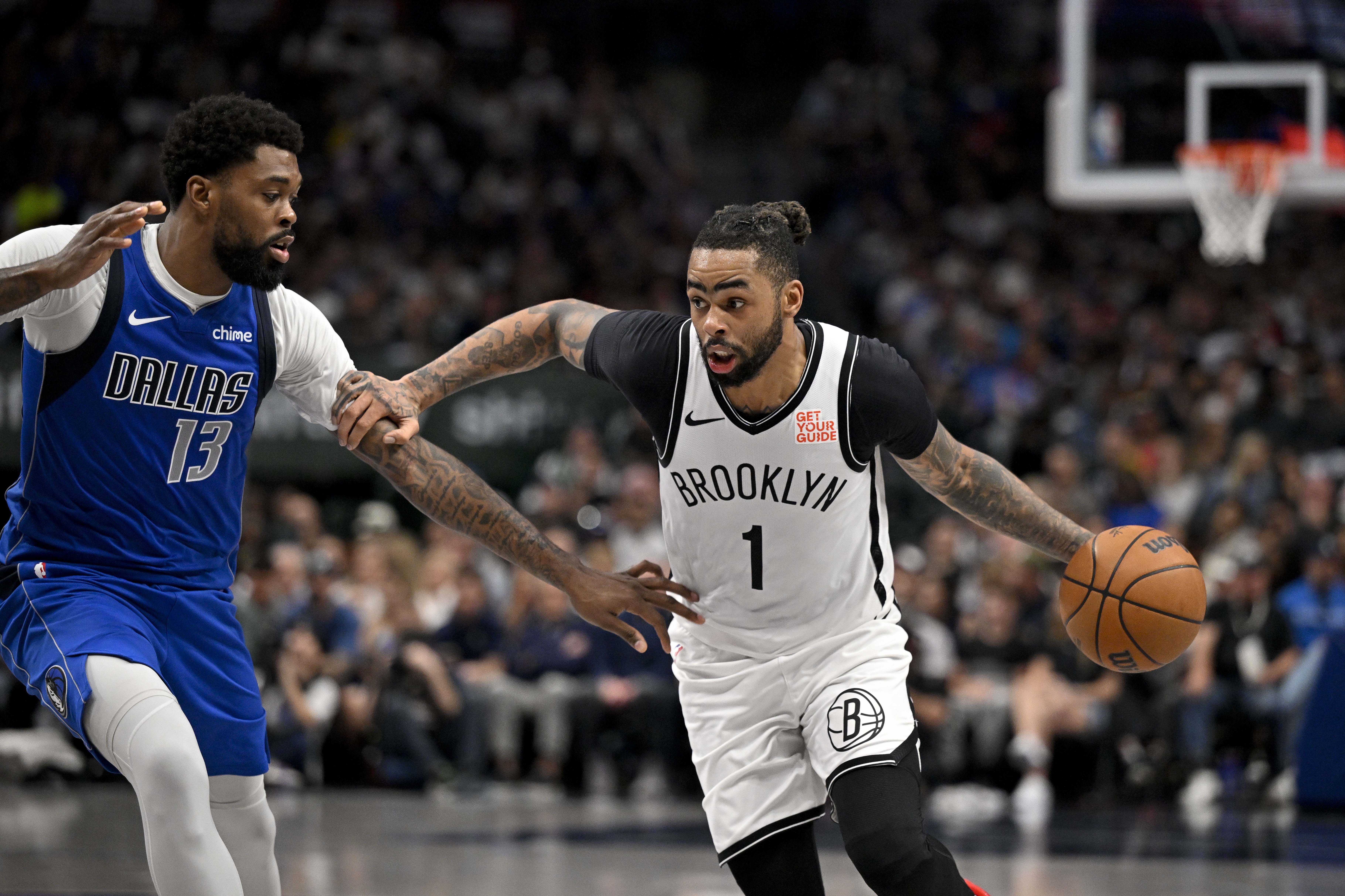 Brooklyn Nets guard D'Angelo Russell (1) drives to the basket past Dallas Mavericks forward Naji Marshall (13) during the second half at the American Airlines Center.