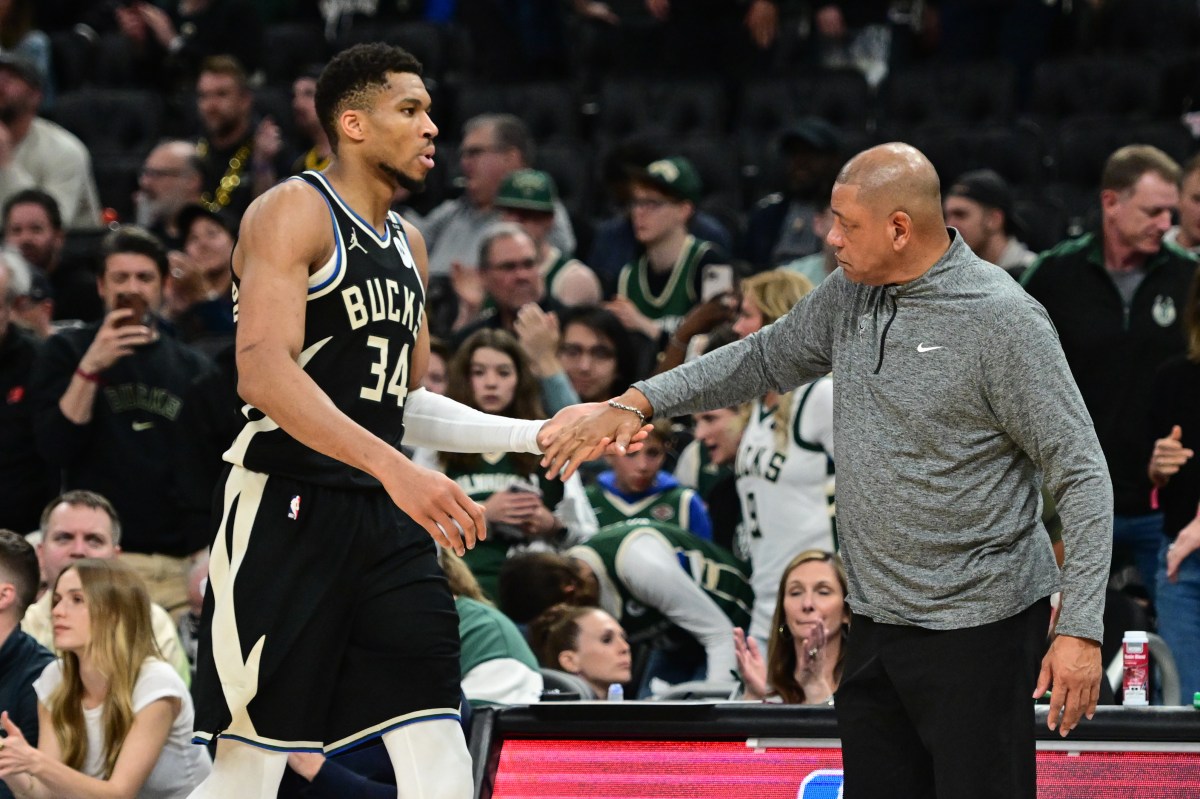 Apr 27, 2025; Milwaukee, Wisconsin, USA; Milwaukee Bucks forward Giannis Antetokounmpo (34) exits the game in the fourth quarter as head coach Doc Rivers shakes his hand during game four against the Indiana Pacers of first round for the 2024 NBA Playoffs at Fiserv Forum. Mandatory Credit: Benny Sieu-Imagn Images