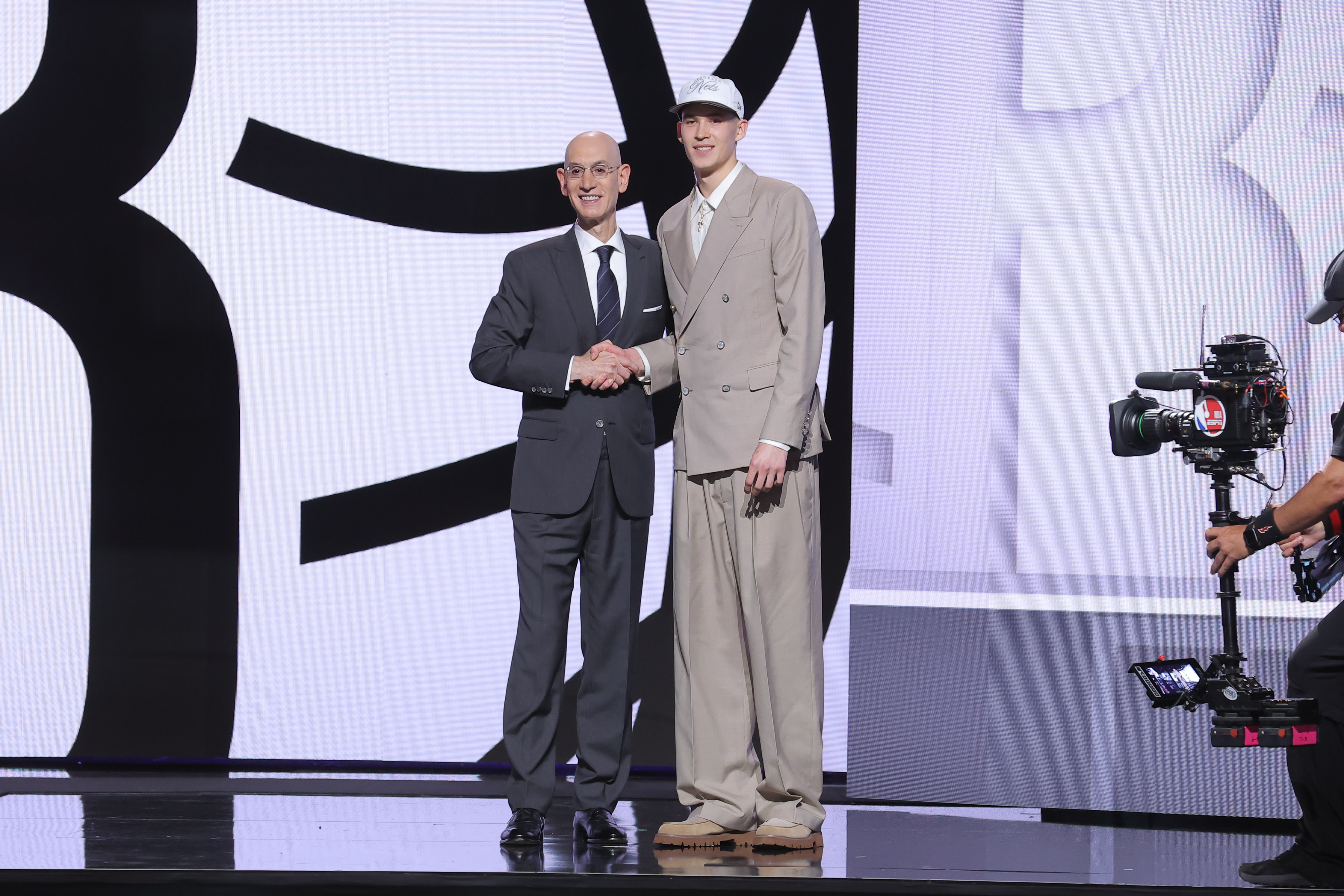 Egor Demin stands with NBA commissioner Adam Silver after being selected as the eighth pick by the Brooklyn Nets in the first round of the 2025 NBA Draft at Barclays Center.