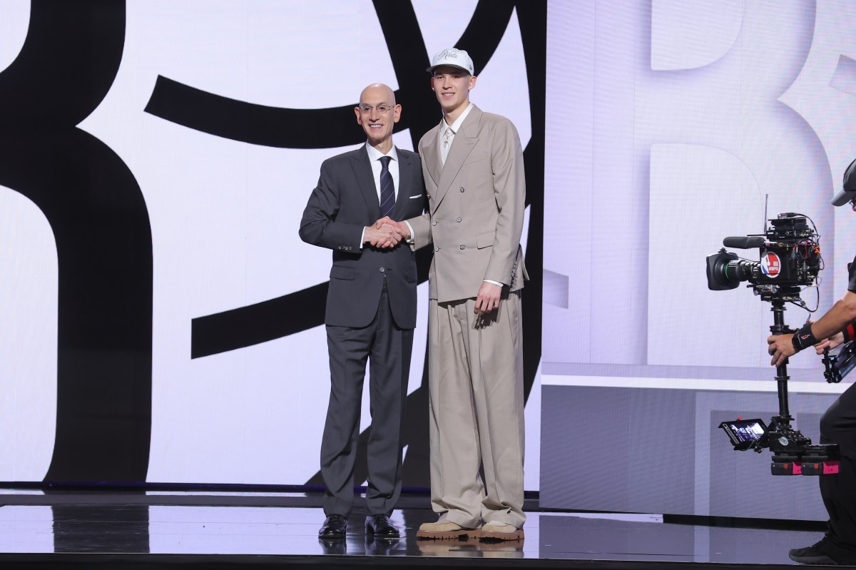 Egor Demin stands with NBA commissioner Adam Silver after being selected as the eighth pick by the Brooklyn Nets in the first round of the 2025 NBA Draft at Barclays Center.