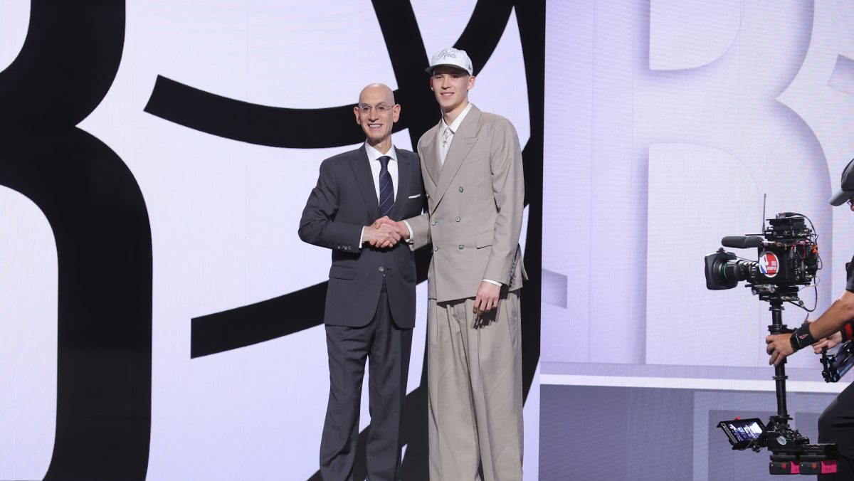Jun 25, 2025; Brooklyn, NY, USA; Egor Demin stands with NBA commissioner Adam Silver after being selected as the eighth pick by the Brooklyn Nets in the first round of the 2025 NBA Draft at Barclays Center. Mandatory Credit: Brad Penner-Imagn Images