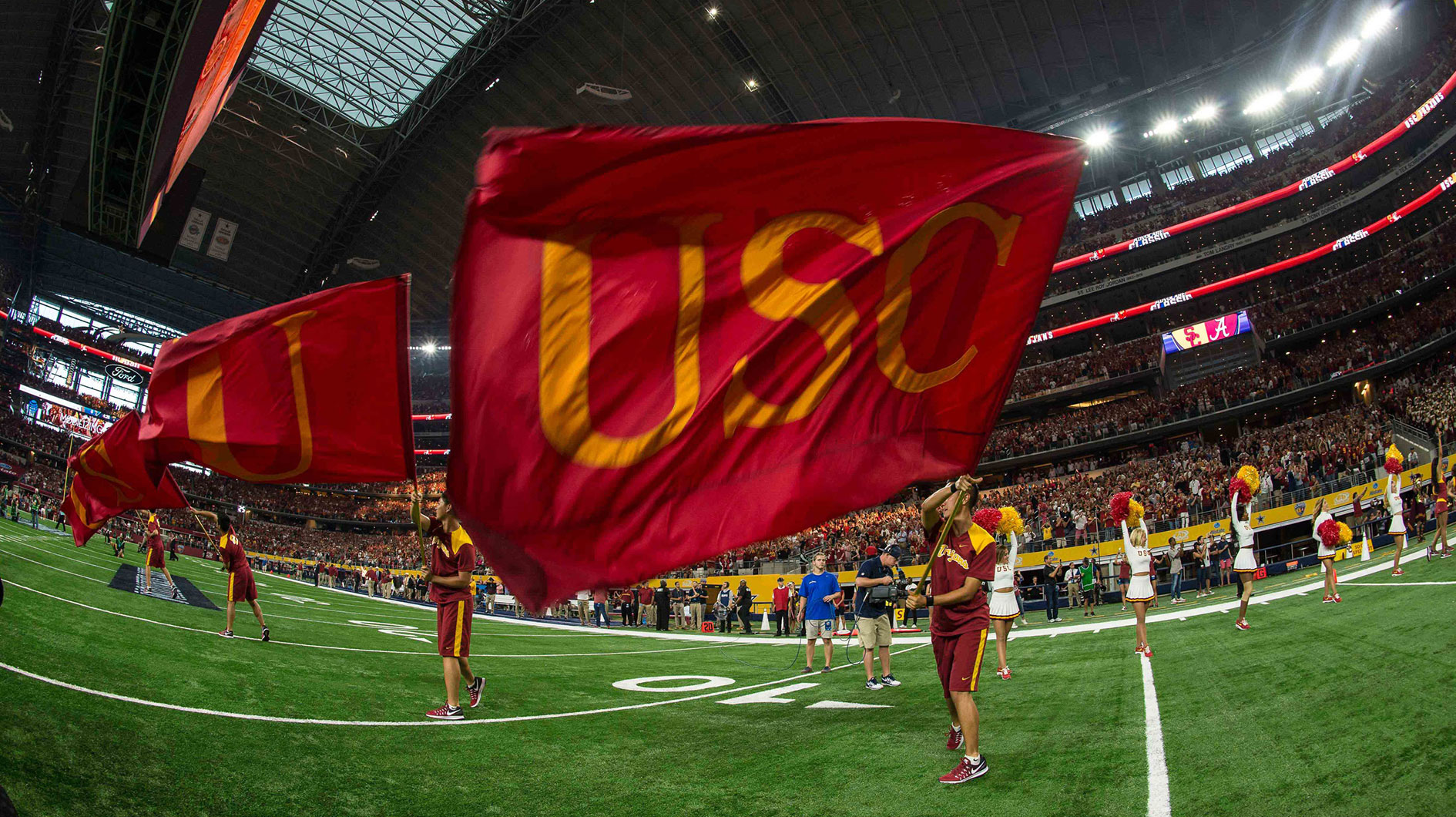 The USC Trojans cheerleaders wave a USC flag before the game between the Alabama Crimson Tide and the USC Trojans at AT&T Stadium. Alabama defeats USC 52-6.