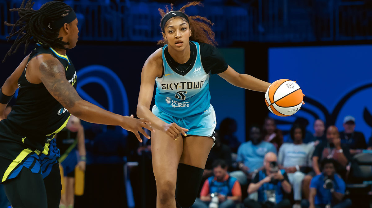 Chicago Sky forward Angel Reese (5) dribbles the ball upcourt against Dallas Wings forward Myisha Hines-Allen (2) during the first half at College Park Center.