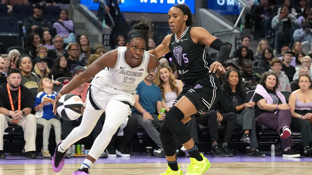 Las Vegas Aces guard Chelsea Gray (12) dribbles against Golden State Valkyries forward Kayla Thornton (5) during the third quarter at Chase Center.