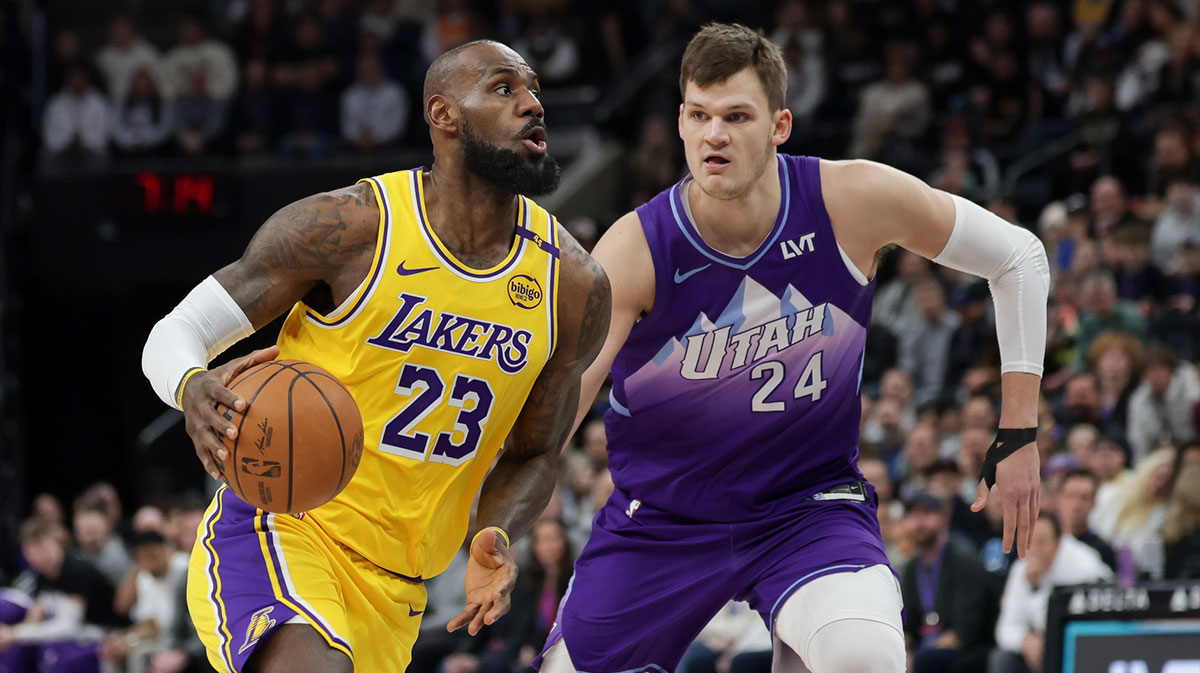 Los Angeles Lakers forward LeBron James (23) dribbles past Utah Jazz center Walker Kessler (24) during the first quarter at Delta Center.