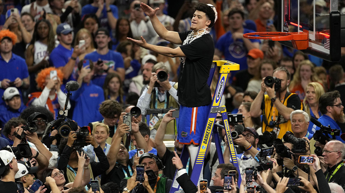 Florida Gators guard Walter Clayton Jr. (1) cuts the net after defeating the Houston Cougars in the national championship game of the Final Four of the 2025 NCAA Tournament at the Alamodome.