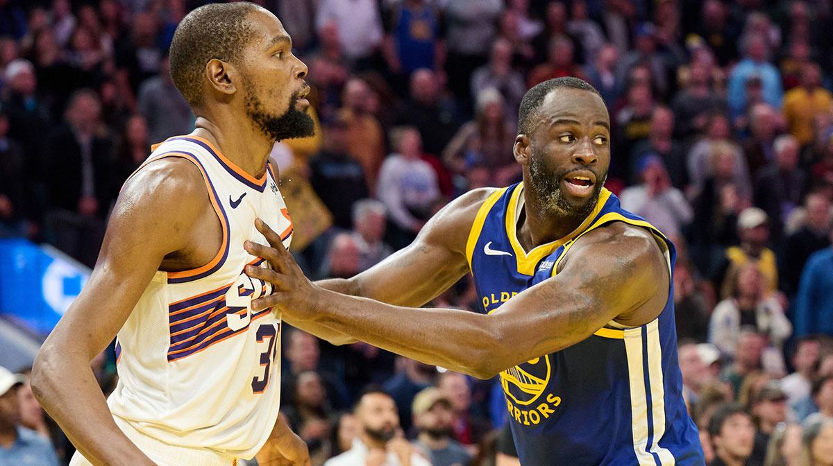 Warriors forward Draymond Green (23) defends against Phoenix Suns forward Kevin Durant (35) during the fourth quarter at Chase Center