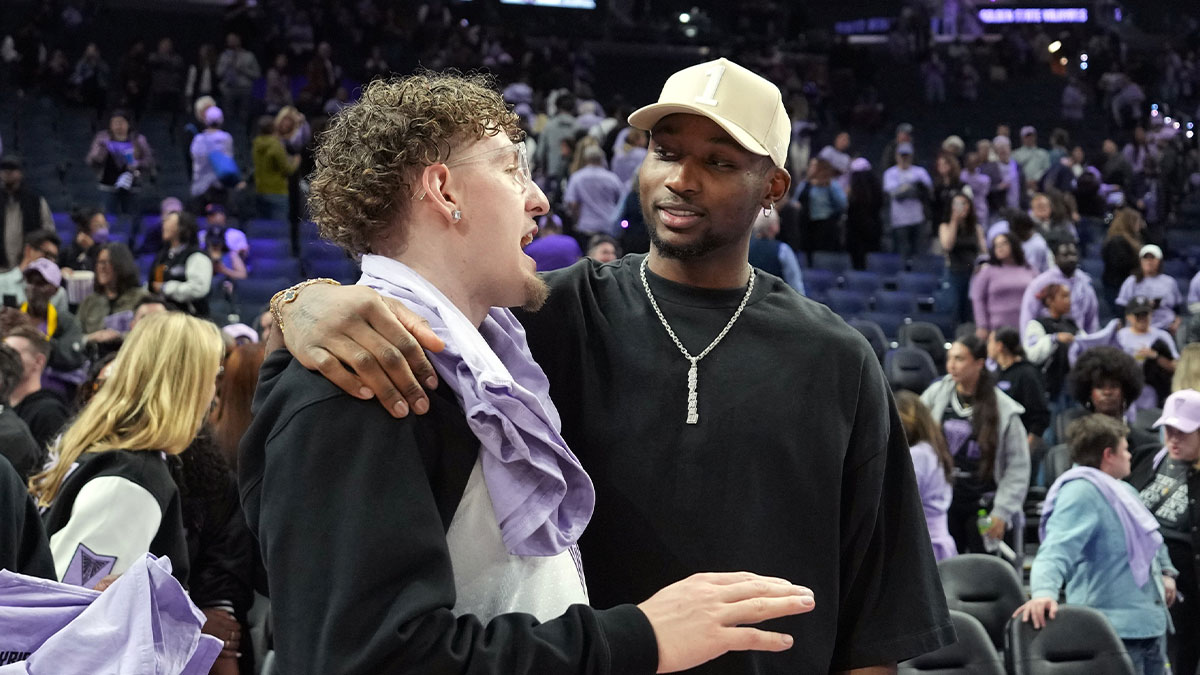 Golden State Warriors guard Brandin Podziemski (left) and Jonathan Kuminga (right) talk after the game between the Golden State Valkyries and the Los Angeles Sparks at Chase Center