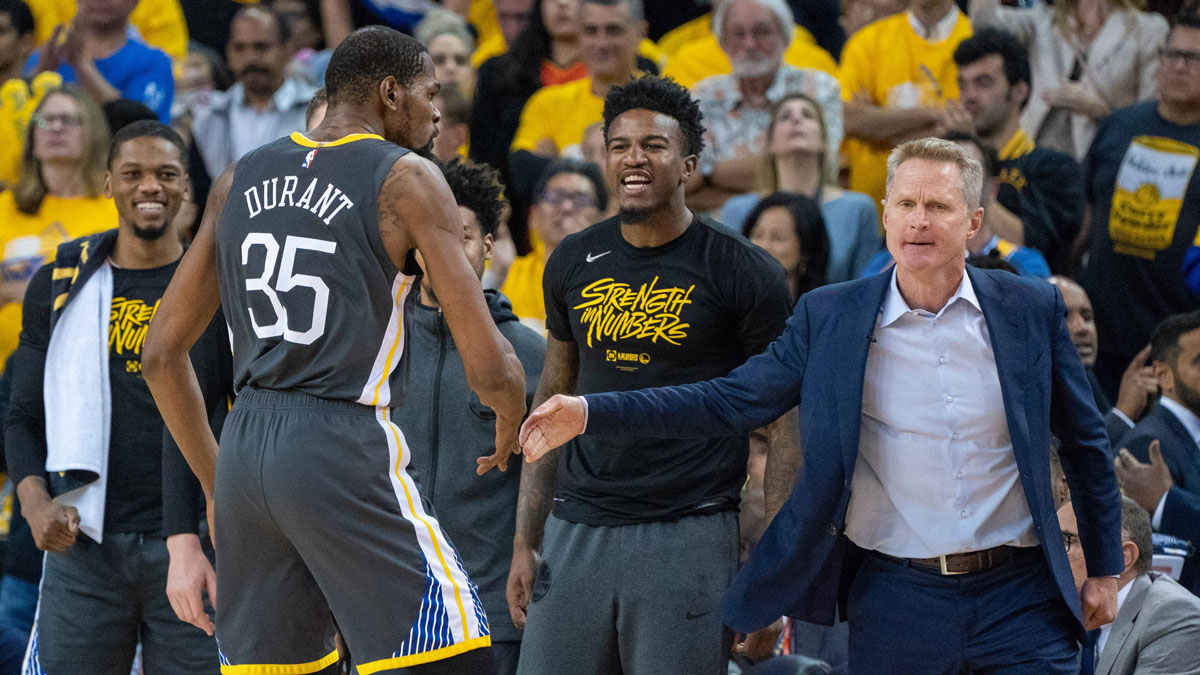 Golden State Warriors forward Kevin Durant (35) celebrates with head coach Steve Kerr (right) during the fourth quarter in game two of the second round of the 2019 NBA Playoffs against the Houston Rockets at Oracle Arena. The Warriors defeated the Rockets 115-109.