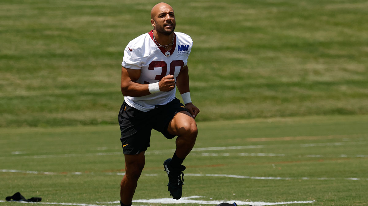 Washington Commanders running back Austin Ekeler (30) participates in a drill on day one of minicamp at Commanders Park.