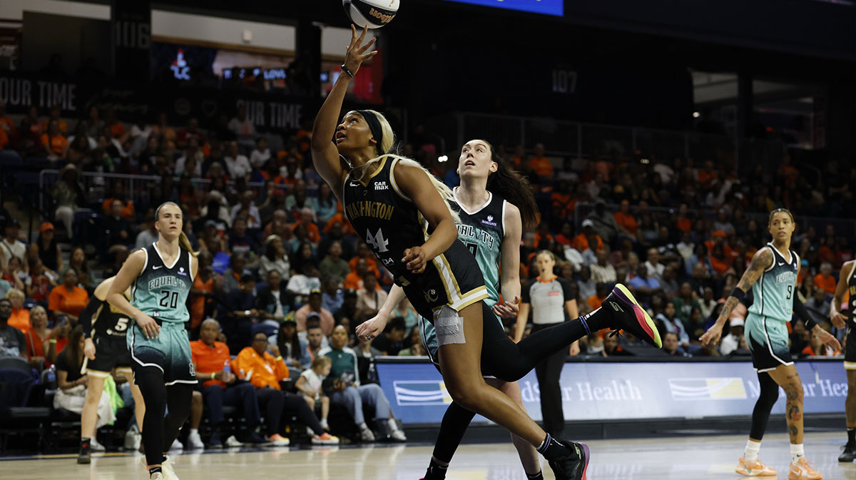 Washington Mystics forward Kiki Iriafen (44) shoots the ball as New York Liberty forward Breanna Stewart (30) defends in the second half at Entertainment & Sports Arena.
