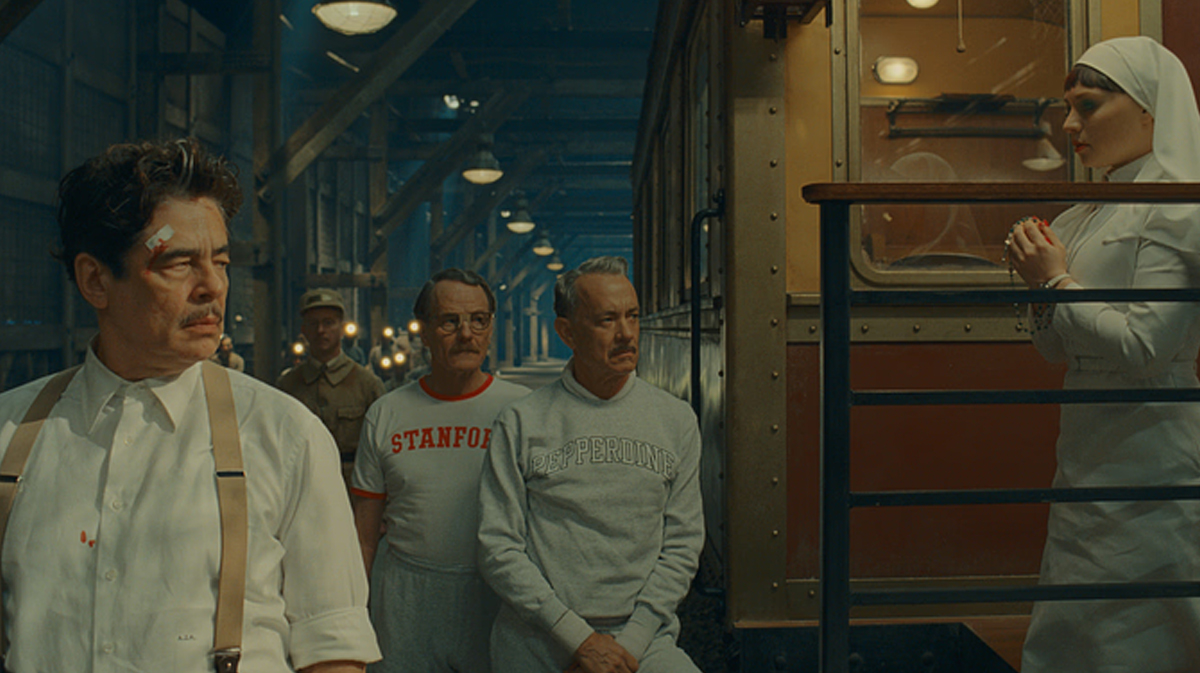 Benicio del Toro, Bryan Cranston, Tom Hanks, and Mia Threapleton in Wes Anderson's new movie The Phoenician Scheme.