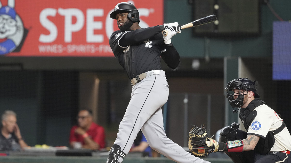 Chicago White Sox outfielder Luis Robert Jr. (88) follows through on his RBI single against the Texas Rangers during the fifth inning at Globe Life Field.