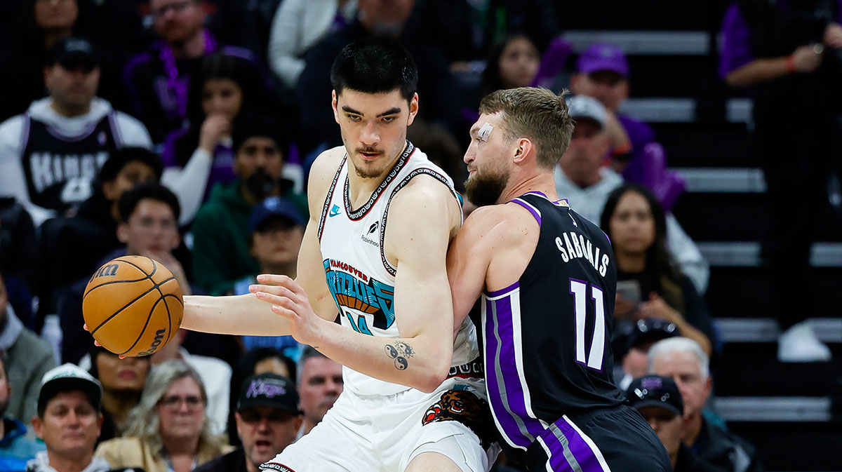 Memphis Grizzlies center Zach Edey (14) controls the ball against Sacramento Kings forward Domantas Sabonis (11) during the second quarter at Golden 1 Center.