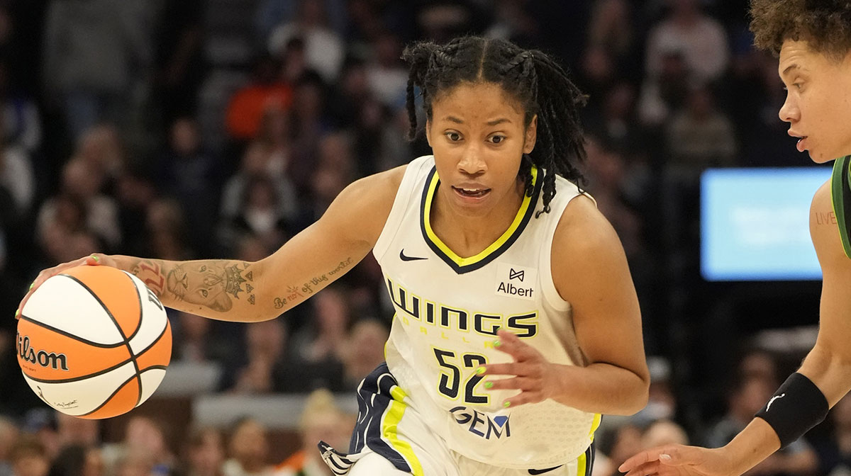 Dallas Wings guard Tyasha Harris (52) drives to the basket against Minnesota Lynx guard Natisha Hiedeman (2) in the second quarter at Target Center.