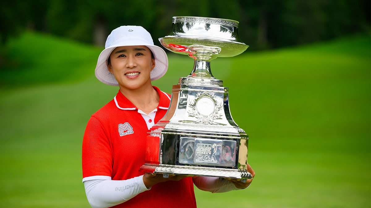 LPGA player Amy Yang holds the trophy after winning the KPMG Women's PGA Championship golf tournament.