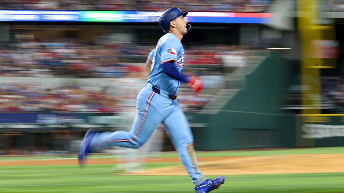 Jun 1, 2025; Arlington, Texas, USA; Texas Rangers center fielder Wyatt Langford (36) runs to first base during the fifth inning against the St. Louis Cardinals at Globe Life Field. Mandatory Credit: Kevin Jairaj-Imagn Images
