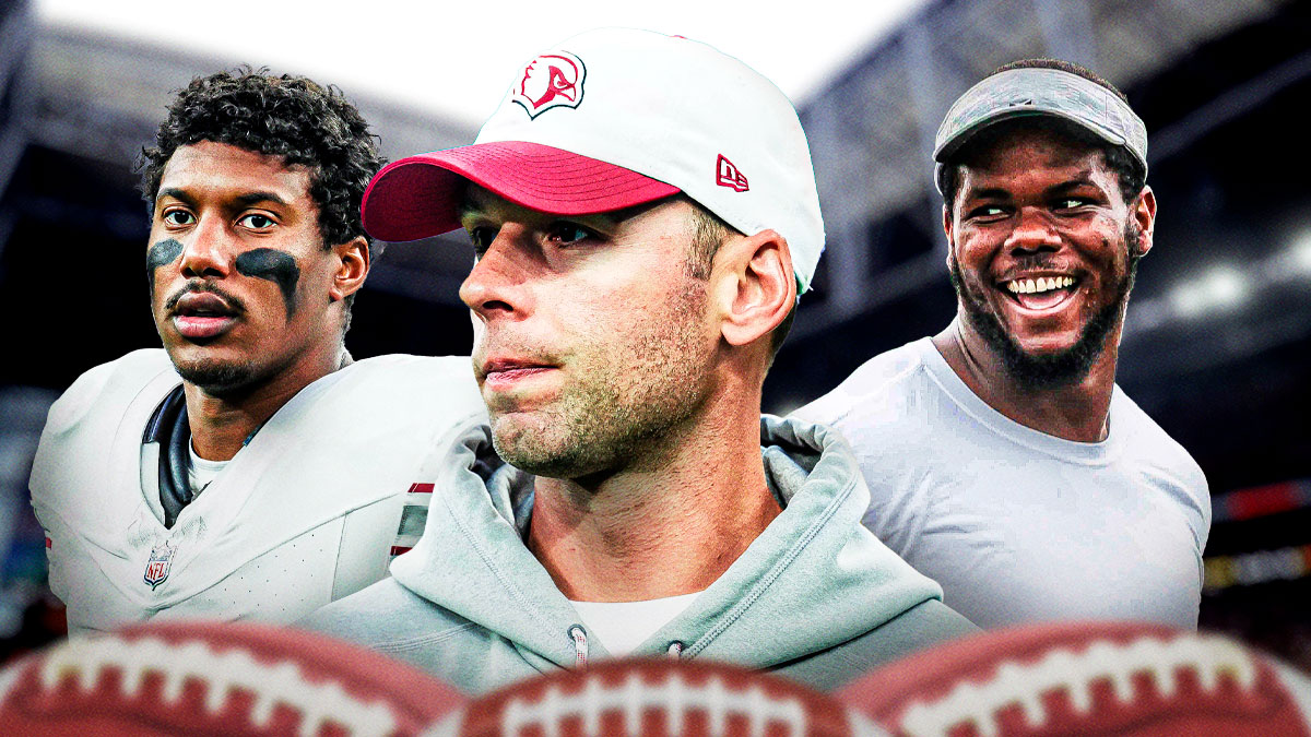 Cardinals coach Jonathan Gannon (center) with Cardinals WR Zay Jones and Cardinals DL Bilal Nichols behind him