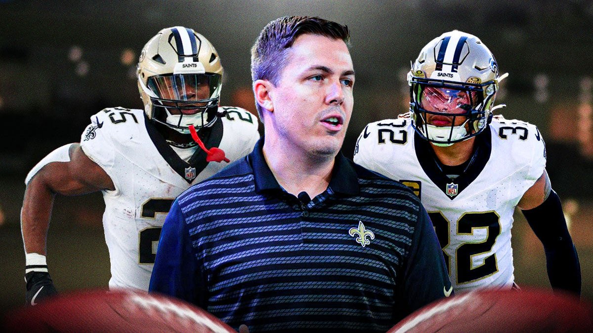 Saints coach Kellen Moore (center) with Saints safety Tyrann Mathieu and Saints RB Kendre Miller behind him