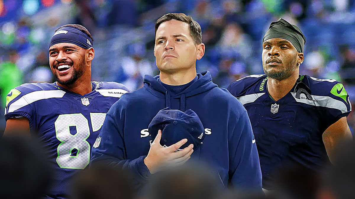 Seahawks HC Mike Macdonald (center) with Seahawks TE Noah Fant and Seahawks WR Marquez Valdes-Scantling behind him.