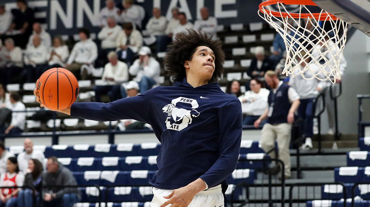 Penn State Nittany Lions forward Yanic Konan Niederhauser (14) attempts to dunk the ball during a warm up prior to the game against the Ohio State Buckeyes at Rec Hall.