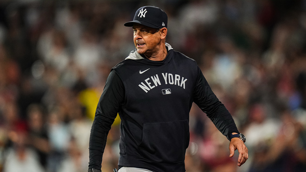 New York Yankees manager Aaron Boone (17) has words with the officials as they take on the Boston Red Sox in the tenth inning at Fenway Park.