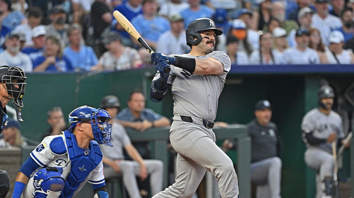 New York Yankees catcher Austin Wells (28) drives in two runs with a double in the sixth inning against the Kansas City Royals at Kauffman Stadium.