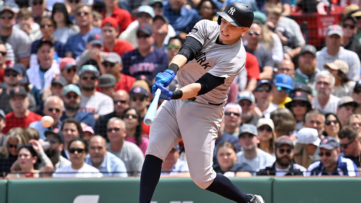 New York Yankees first baseman Ben Rice (22) gets a base hit against the Boston Red Sox during the third inning at Fenway Park.