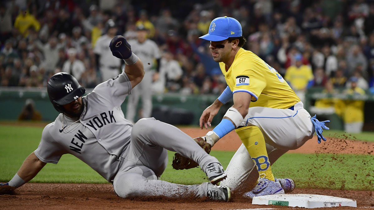 Boston Red Sox third baseman Marcelo Mayer (39) tags out New York Yankees left fielder Jasson Dominguez (24) during the seventh inning at Fenway Park.