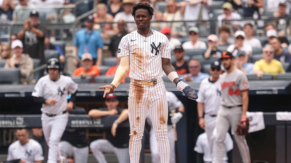 New York Yankees second baseman Jazz Chisholm Jr. (13) reacts after losing both cleats whole scoring a run and colliding with Baltimore Orioles catcher Maverick Handley (not pictured) during the second inning at Yankee Stadium.