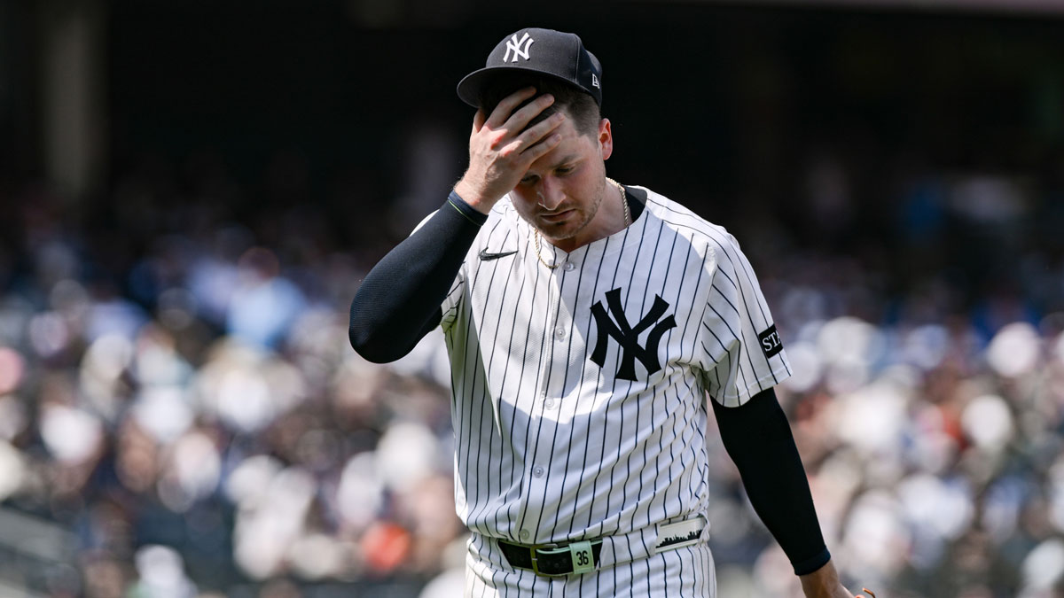 New York Yankees pitcher Clarke Schmidt (36) reacts to the hot weather during the fifth inning against the Baltimore Orioles at Yankee Stadium. M