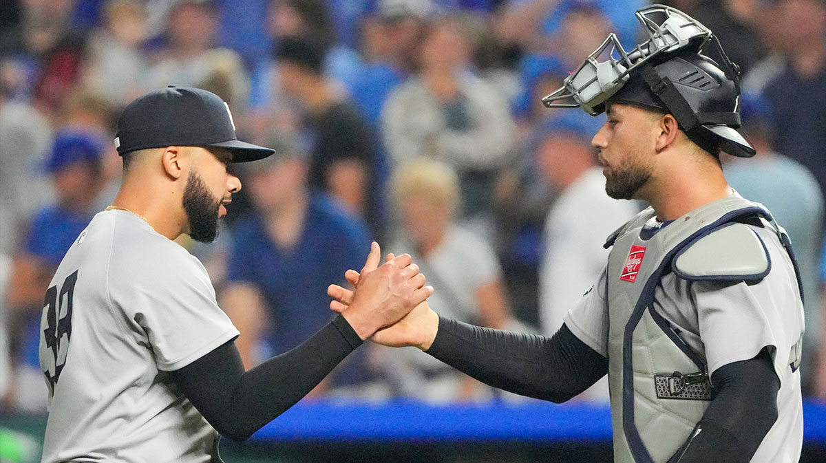 New York Yankees relief pitcher Devin Williams (38) celebrates with catcher J.C. Escarra (25) after the win over the Kansas City Royals at Kauffman Stadium.