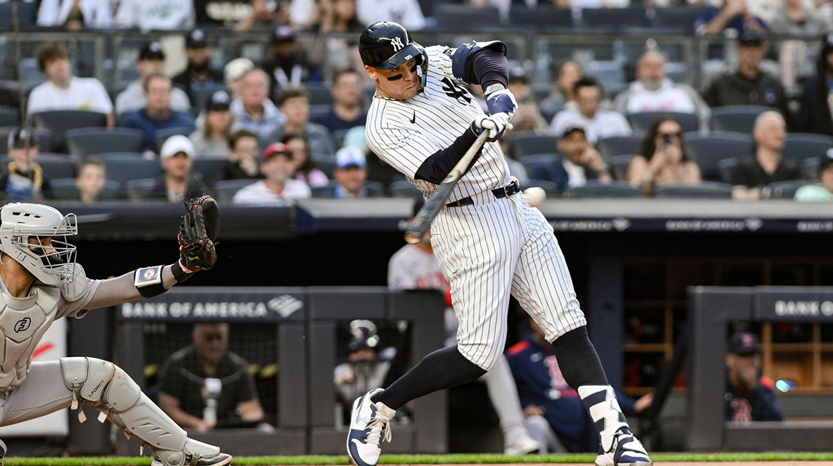 New York Yankees outfielder Aaron Judge (99) hits a two-run home run against the Boston Red Sox during the first inning at Yankee Stadium.