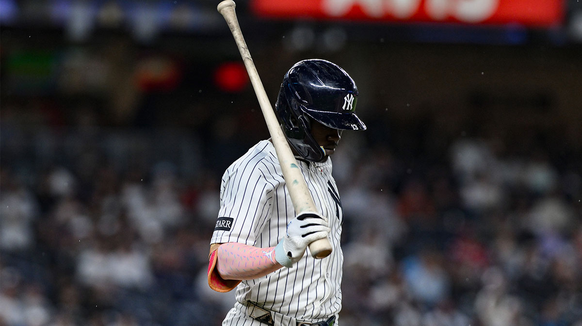 New York Yankees second baseman Jazz Chisholm Jr. (13) reacts after striking out against the Boston Red Sox during the eighth inning at Yankee Stadium.