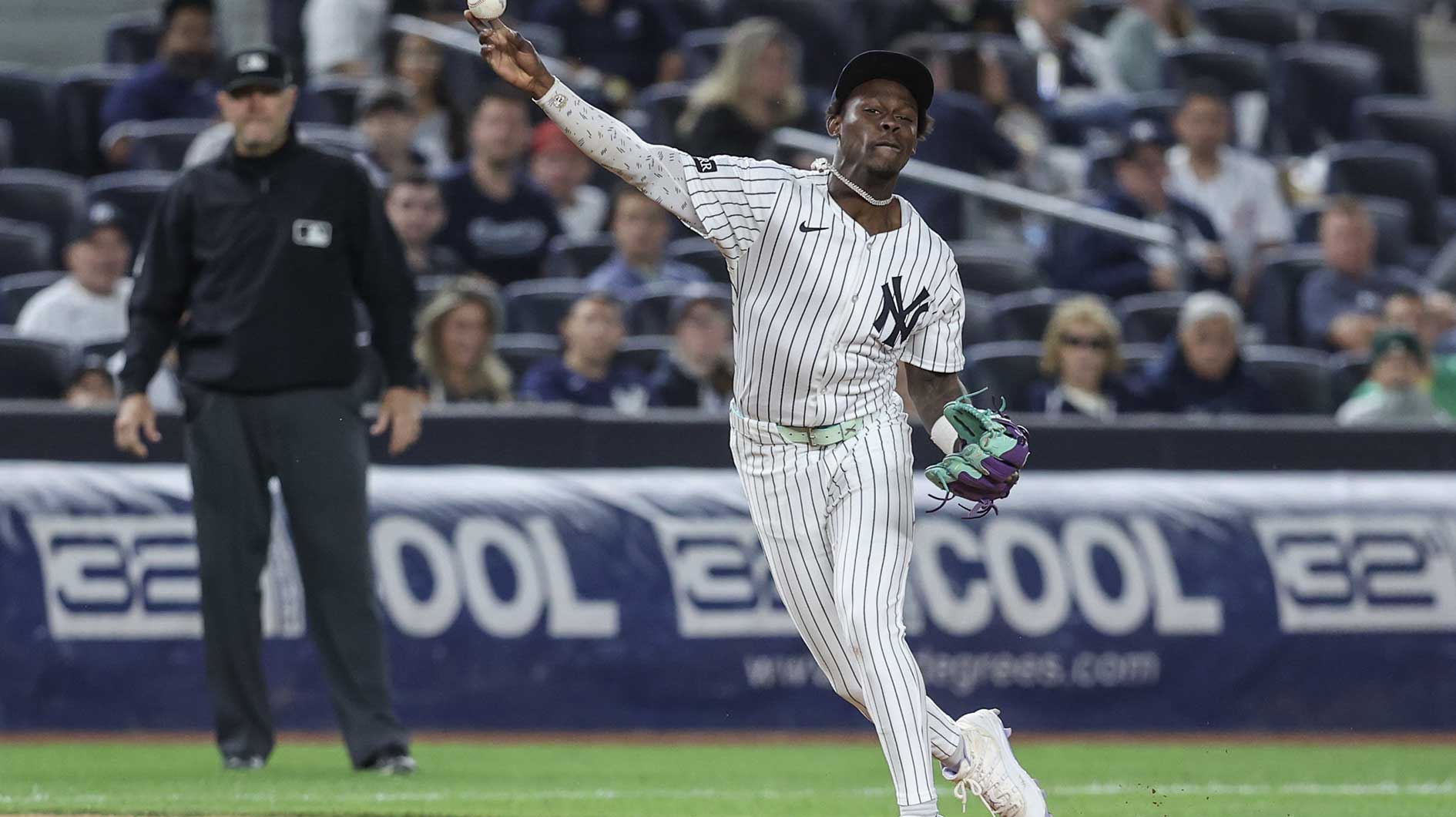 New York Yankees third baseman Jazz Chisholm Jr. (13) throws a runner out at first base in the ninth inning at Yankee Stadium.