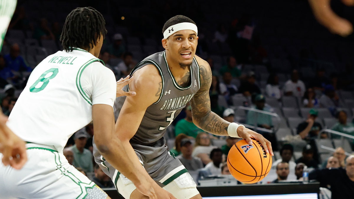 UAB Blazers forward Yaxel Lendeborg (3) controls the ball as North Texas Mean Green forward Grant Newell (8) defends during the first half at Dickies Arena.