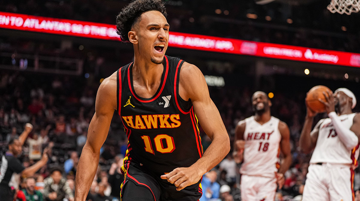 Atlanta Hawks forward Zaccharie Risacher (10) reacts after scoring a basket against the Miami Heat during the first half at State Farm Arena.