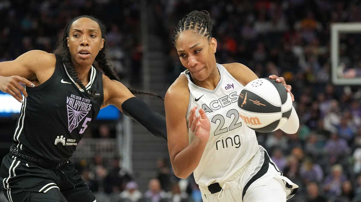 Las Vegas Aces center A'ja Wilson (22) dribbles against Golden State Valkyries forward Kayla Thornton (5) during the third quarter at Chase Center.