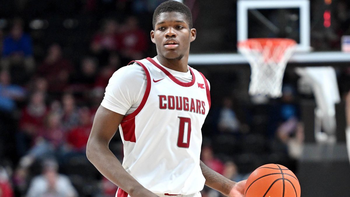Washington State Cougars guard Cedric Coward (0) controls the ball against the Eastern Washington Eagles in the second half at Spokane Veterans Memorial Arena.
