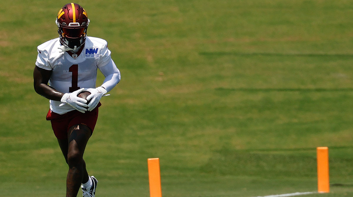 Washington Commanders wide receiver Deebo Samuel Sr. (1) runs with the ball after making a catch during drills on day one of minicamp at Commanders Park.