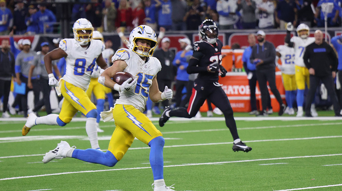 Los Angeles Chargers wide receiver Ladd McConkey (15) scores on a pass in the fourth quarter against the Houston Texans in an AFC wild card game at NRG Stadium.