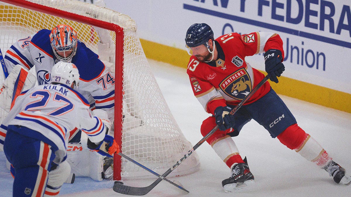 Florida Panthers forward Sam Reinhart (13) attempts a wrap around against Edmonton Oilers goaltender Stuart Skinner (74) and defenseman Brett Kulak (27) during the second period in game three of the 2025 Stanley Cup Final at Amerant Bank Arena.