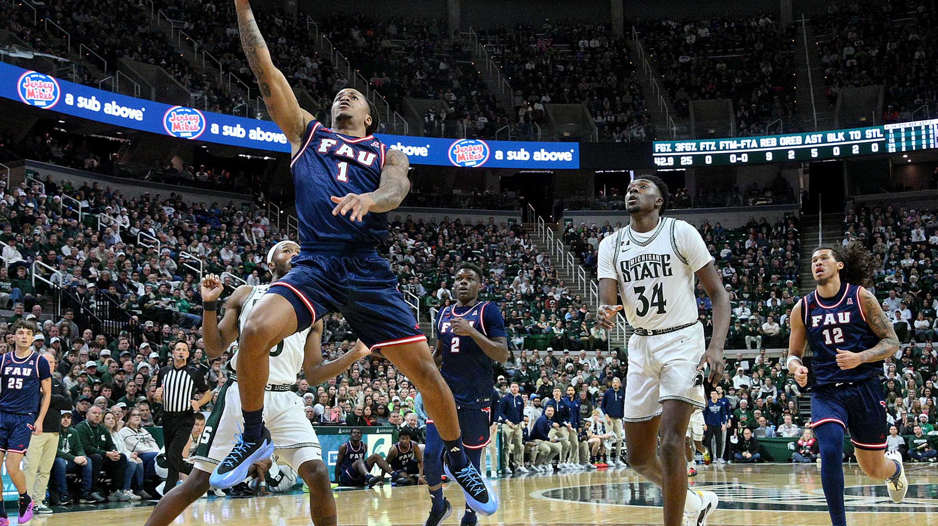 Florida Atlantic Owls forward Kaleb Glenn (1) scores on a steal during the first half against the Michigan State Spartans at Jack Breslin Student Events Center.