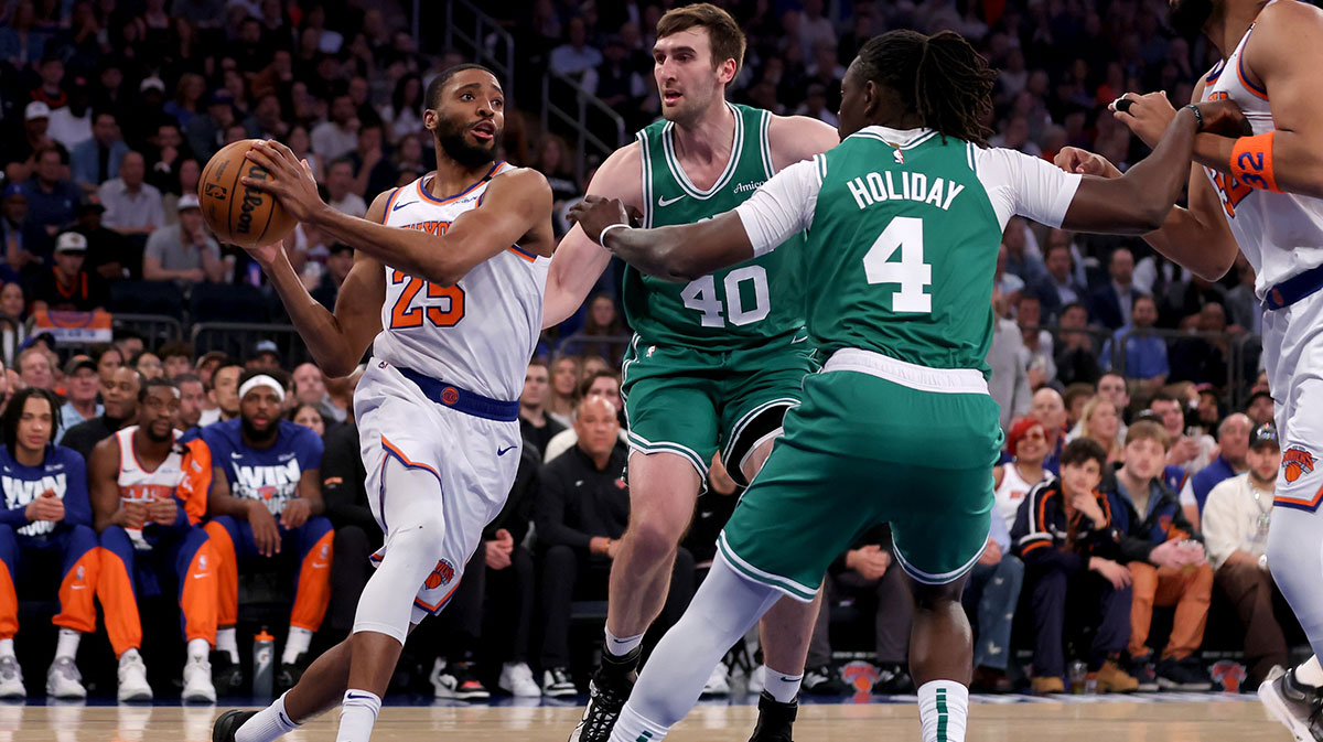 New York Knicks forward Mikal Bridges (25) drives to the basket against Boston Celtics center Luke Kornet (40) and guard Jrue Holiday (4) during the first quarter of game six in the second round of the 2025 NBA Playoffs at Madison Square Garden.