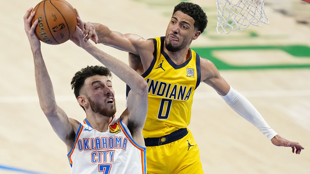 Oklahoma City Thunder forward Chet Holmgren (7) shoots the ball against Indiana Pacers guard Tyrese Haliburton (0) during the second quarter in game one of the 2025 NBA Finals at Paycom Center.