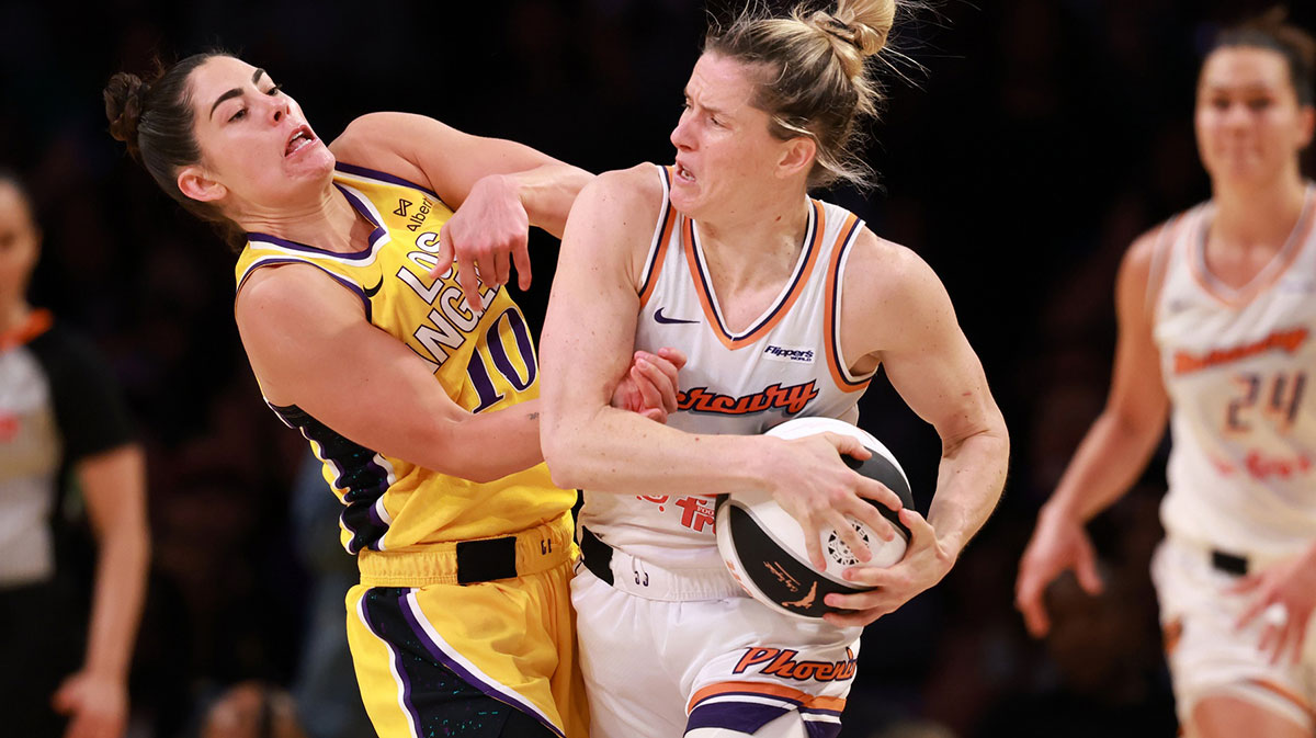 Los Angeles Sparks guard Kelsey Plum (10) and Phoenix Mercury guard Sami Whitcomb (33) fight for a ball during the second half at Crypto.com Arena.
