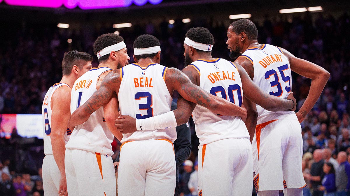 Phoenix Suns guard Grayson Allen (8) and guard Devin Booker (1) and guard Bradley Beal (3) and forward Royce O'Neale (00) and forward Kevin Durant (35) huddle up before the final seconds of the fourth quarter at Golden 1 Center.