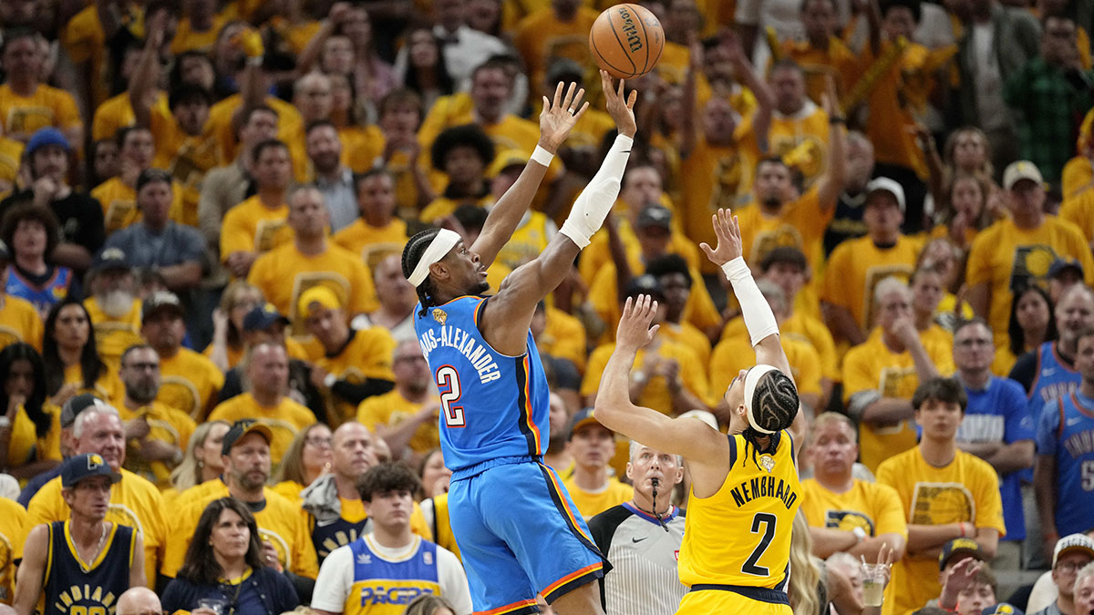 Thunder guard Shai Gilgeous-Alexander (2) shoots the ball against Indiana Pacers guard Andrew Nembhard (2) during the second half during game four of the 2025 NBA Finals at Gainbridge Fieldhouse
