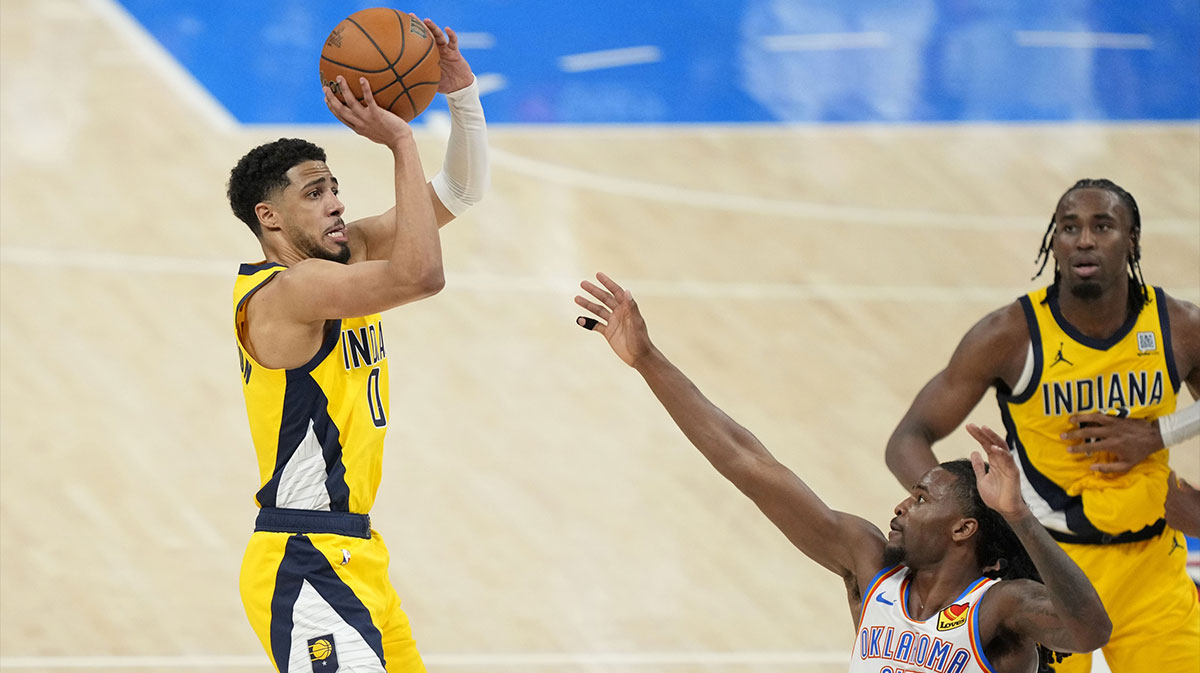 Oklahoma City, Oklahoma, USA; Indiana Pacers guard Tyrese Haliburton (0) shoots the ball against Oklahoma City Thunder guard Cason Wallace (22) during the fourth quarter in game one of the 2025 NBA Finals at Paycom Center.