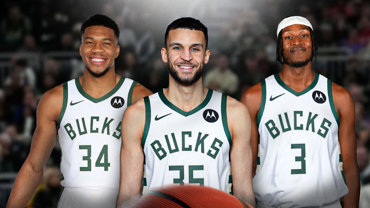 Pete Nance wearing a Milwaukee Bucks jersey in the middle, Giannis Antetokounmpo and Myles Turner around him